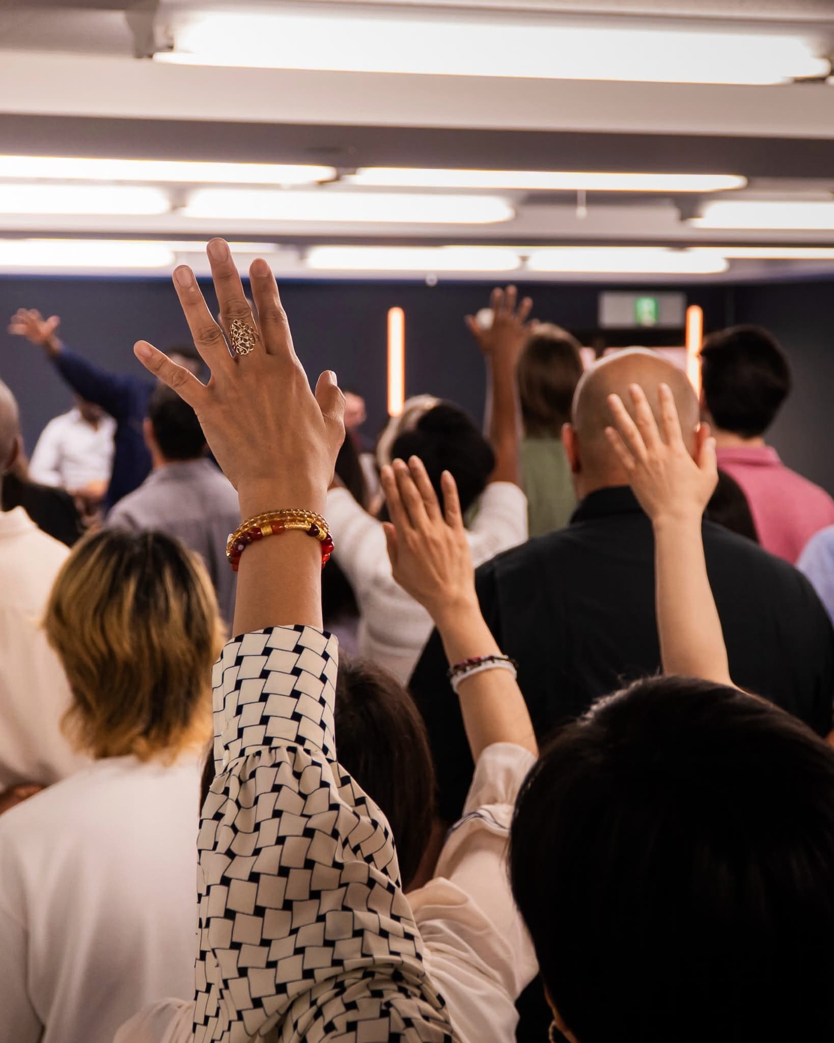 People worshipping together in a church gathering